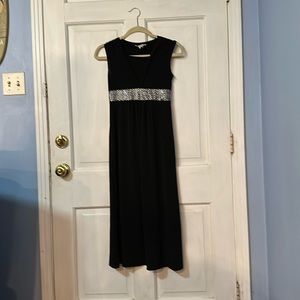 Size 8/10. Poleyester spandex with sequins.